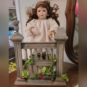 Elegant Porcelain Doll with Brown Hair and Cream Dress
